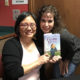 Linda Sue Park holds her new release, Prairie Lotus, with an appreciative Silvia Acevedo