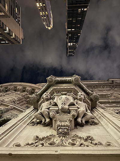 Photo looking up from the archway of The Alwyn Court at 7th Ave & 58th Street in Midtown Manhattan, designed by Harde & Short in the French Renaissance style.