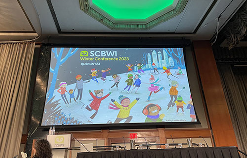 Photo shows opening slide of SCBWI New York City conference