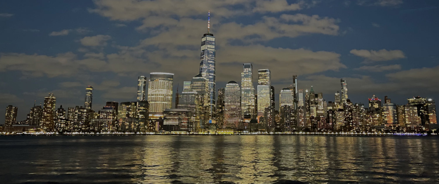 Photo shows the New York City skyland with Hudson River in foregrount
